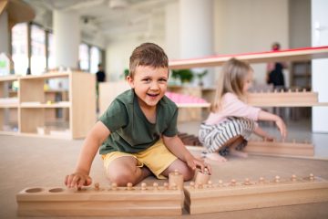 group of small nursery school children playing ind pujfmez